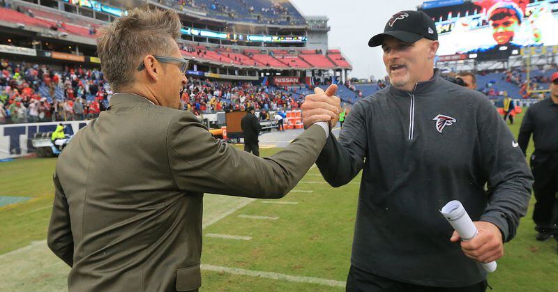 102515 NASHVILLE: -- Falcons general manager Thomas Dimitroff (left) and head coach Dan Quinn celebrate surviving the Titans for a 10-7 victory in a football game on Sunday, Oct. 25, 2015, in Nashville. Curtis Compton / ccompton@ajc.com