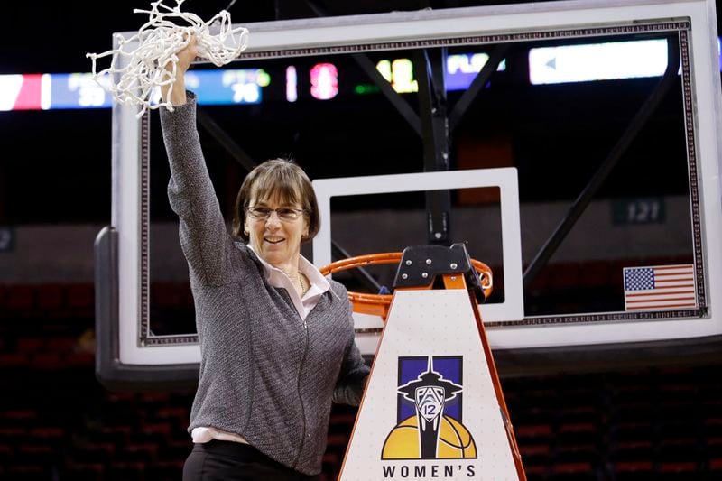 FILE - In this March 5, 2017, file photo, Stanford head coach Tara VanDerveer waves the net after finishing cutting it down after her team beat Oregon State in the Pac-12 Conference championship NCAA college basketball game in Seattle.. VanDerveer, the winningest basketball coach in NCAA history, announced her retirement Tuesday night, April 9, 2024, after 38 seasons leading the Stanford women’s team and 45 years overall. (AP Photo/Elaine Thompson, File)