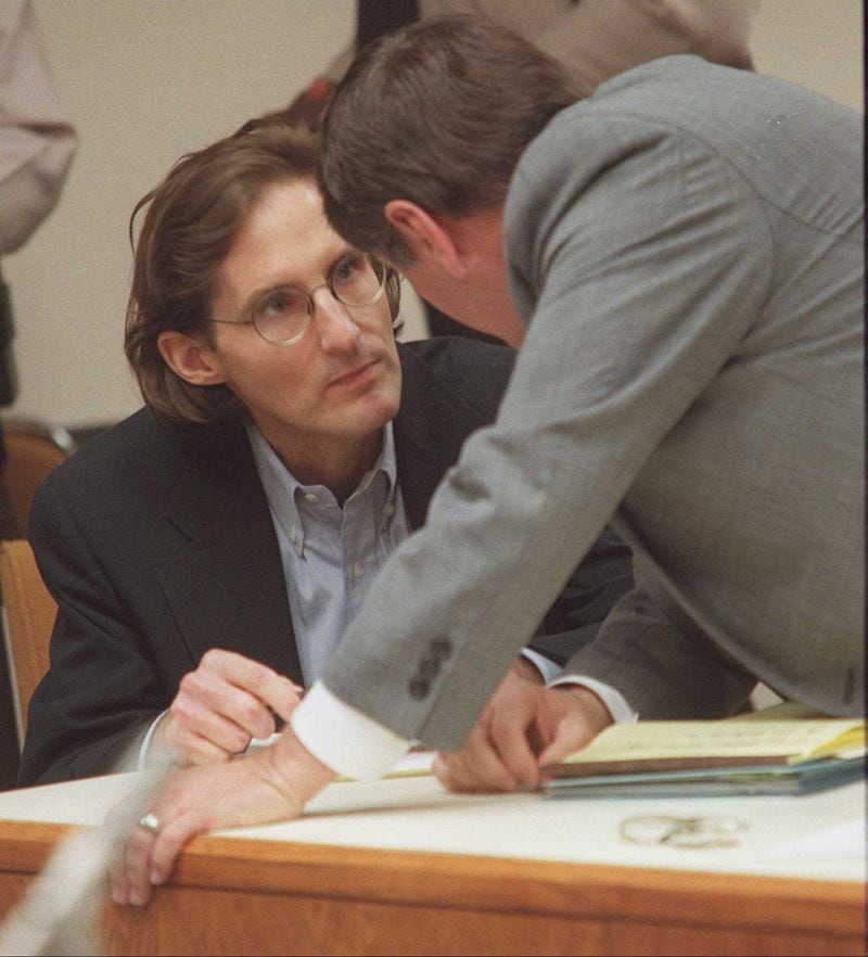 On the left, Fred Tokars listens to one of his defense lawyers, Jim Berry, right, during a hearing in Cobb Superior Court Thursday, January 4, 1996, to decide which issues will go to the state supreme court for his death penalty trial.