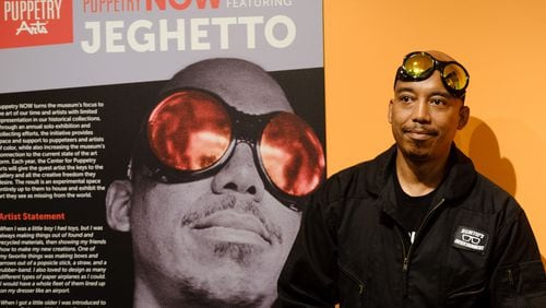 Tarish “Jeghetto” Pipkins prepares to speak at the opening of his installation at the Center for Puppetry Arts. (Arvin Temkar / arvin.temkar@ajc.com)