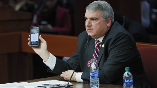 State Rep. John Carson, R-Marietta, presents House Bill 113 on Monday. The bill would raise fines for distracted driving citations. Some lawmakers were skeptical. Bob Andres / bandres@ajc.com
