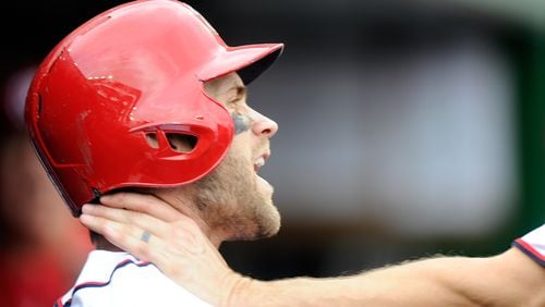 WASHINGTON, DC - SEPTEMBER 27: Bryce Harper #34 of the Washington Nationals is grabbed by Jonathan Papelbon #58 in the eighth inning against the Philadelphia Phillies at Nationals Park on September 27, 2015 in Washington, DC. (Photo by Greg Fiume/Getty Images)