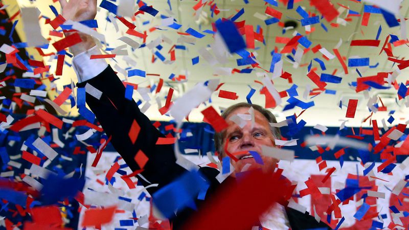 Democrat Doug Jones waves to supporters Tuesday, Dec. 12, 2017, in Birmingham, Ala. In a stunning victory aided by scandal, Jones won Alabama's special Senate election, beating back history, an embattled Republican opponent and President Donald Trump, who urgently endorsed GOP rebel Roy Moore despite a litany of sexual misconduct allegations. (AP Photo/John Bazemore)