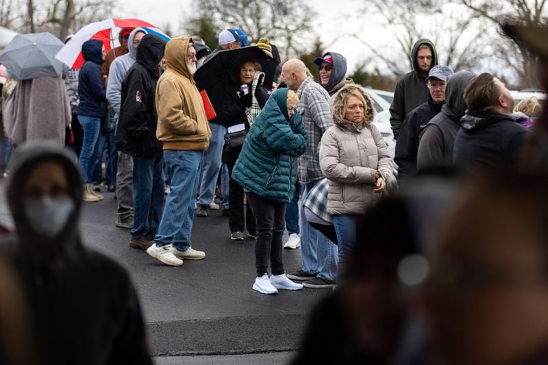 People wait in line for assistance from Norfolk Southern at Abundant Life Fellowship church in New Waterford, Ohio on Friday, Feb. 17, 2023, two weeks after 38 cars of a Norfolk Southern train derailed in East Palestine. (Arvin Temkar / arvin.temkar@ajc.com)