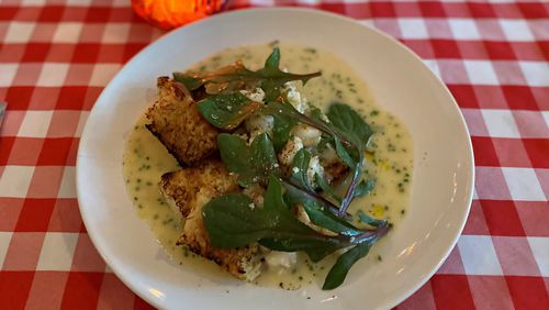 Gigi’s Italian Kitchen & Restaurant sometimes riffs on classics — like this shrimp scampi with focaccia and red-veined spinach. Wendell Brock for The Atlanta Journal-Constitution