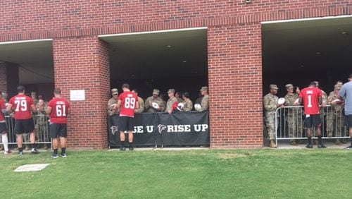 Falcons signing autographs for the soldiers from Fort Benning after practice today. (By D. Orlando Ledbetter/dledbetter@ajc.com)