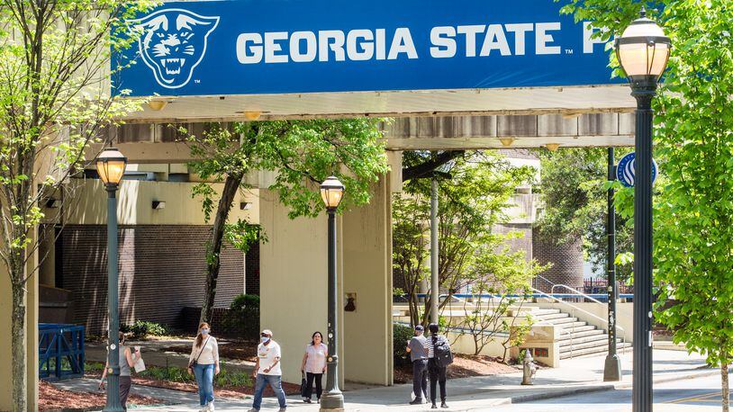 Students are on campus at Georgia State University on Tuesday, April 13, 2021.  The state's Board of Regents announced Wednesday a freeze on tuition and fees for the upcoming school year. (Jenni Girtman for The Atlanta Journal-Constitution)