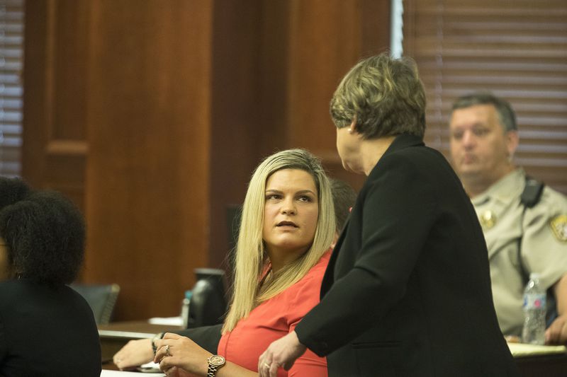 7/11/2019 -- McDonough, Georgia -- Jennifer Rosenbaum (center) speaks with her attorney, Corinne Mull (right), during her and her husband's trial in front of Henry County Judge Brian Amero at the Henry County Superior courthouse, Thursday, July 11, 2019. (Alyssa Pointer/alyssa.pointer@ajc.com)