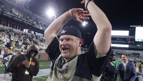 Georgia Tech Yellow Jackets coach Brent Key celebrates after Tech defeated Syracuse 31-22 in Atlanta on Saturday, Nov. 18, 2023.  (Bob Andres for The Atlanta Journal-Constitution)