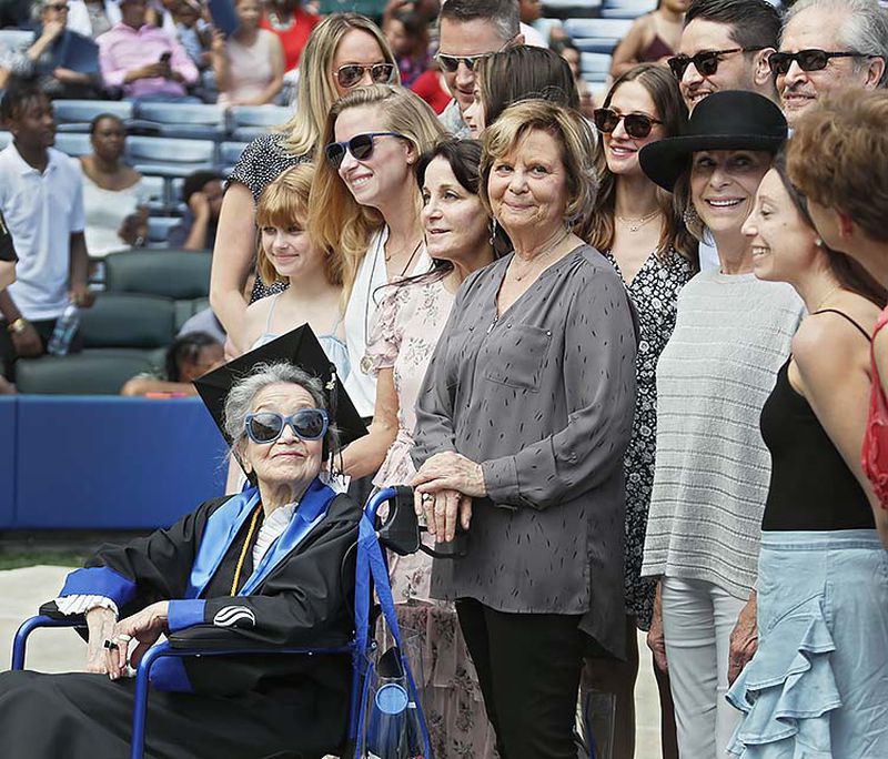 Joyce Lowenstein, 93, gathers with family members for a group photo after she received her bachelor's degree Thursday from Georgia State University.  She started taking classes there in 2012,  Her degree is in art history.    