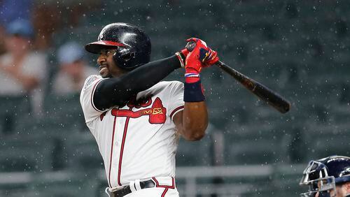 Braves’ Brandon Phillips (4) drives in a run with a double during the fifth inning of the team’s baseball game against the Milwaukee Brewers on Friday, June 23, 2017, in Atlanta. (AP Photo/John Bazemore)