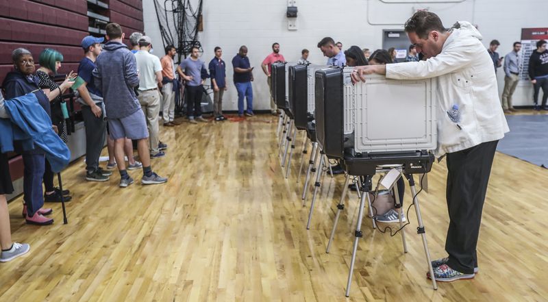 November 6, 2018 Atlanta : Voters waited over an hour to vote at Henry W. Grady High School at 29 Charles Allen Dr NE, in Atlanta on Tuesday Nov. 6, 2018. Metro Atlanta polling places reported steady lines as voters went to the polls Tuesday. Georgia voters were asked Nov. 6 whether the state constitution should be amended to give a 10-year, $200 million boost to land conservation, solidify the states commitment to crime victims and cut timberland taxes. Five proposed amendments appeared on the ballot, which most notably settles the long and hard-fought races for governor and other key offices. JOHN SPINK/JSPINK@AJC.COM