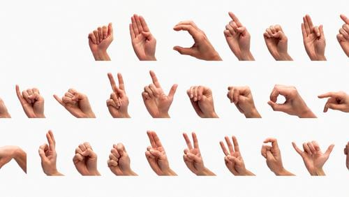 Hands demonstrating the complete US manual alphabet, gesturing the letters 'A' to 'Z', front view.
