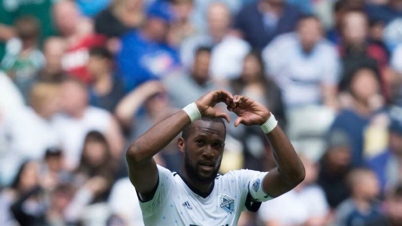 Vancouver Whitecaps’ Kendall Waston celebrates his second goal against Atlanta United during the first half of an MLS soccer match in Vancouver, British Columbia, Saturday, June 3, 2017. (Darryl Dyck/The Canadian Press via AP)