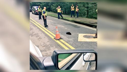 A sinkhole has shut down Powers Ferry Road in Sandy Springs, according to the city. (Credit: Channel 2 Action News)