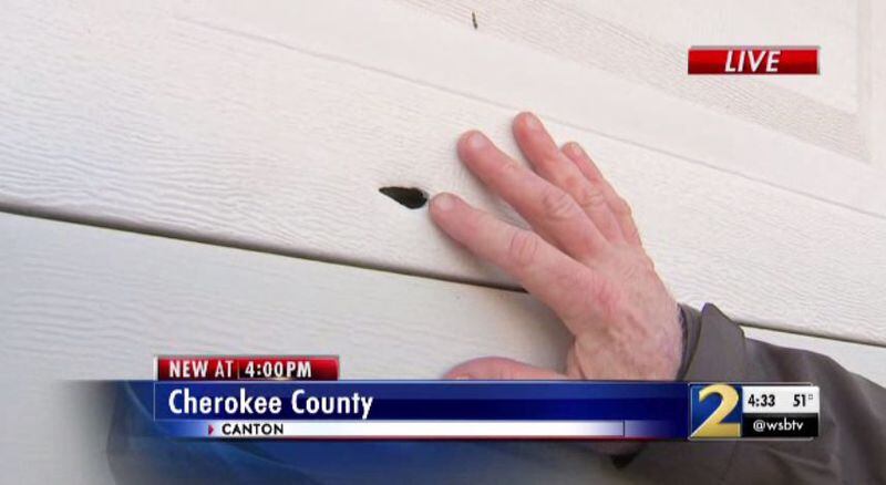 The man found a bullet hole in his garage.