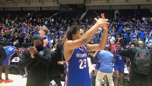 Riverwood's J.R. Leonard shows the crowd where his championship ring is going to go. Leonard scored 31 points to lead the Raiders to a 67-64 OT win over Alexander and win the Class 6A championship, March 8, 2024.