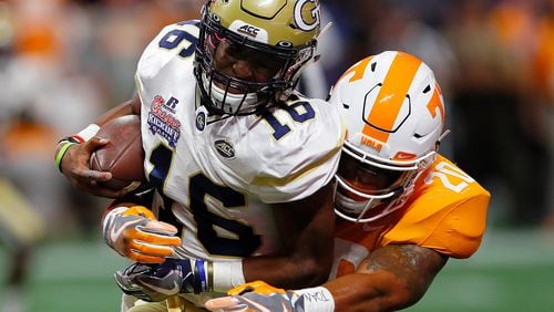 ATLANTA, GA - SEPTEMBER 04:  TaQuon Marshall #16 of the Georgia Tech Yellow Jackets is tackled by Cortez McDowell #20 of the Tennessee Volunteers at Mercedes-Benz Stadium on September 4, 2017 in Atlanta, Georgia.  (Photo by Kevin C. Cox/Getty Images)