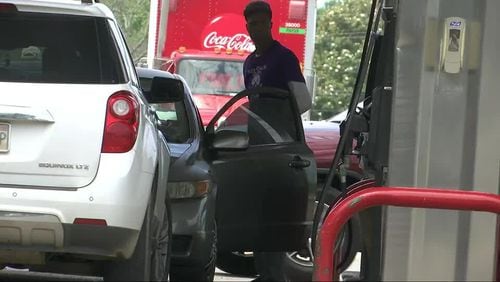 A motorist at a gas station