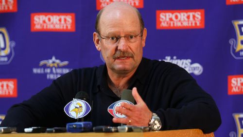 Former Minnesota Vikings head coach Brad Childress answers questions from the media during a press conference in 2010.