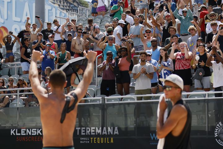 The crowd celebrates the victory with Paul Lotman and Miles Partain after the AVP Gold Series Atlanta Open men's championship match Sunday at Atlantic Station. (Miguel Martinez / miguel.martinezjimenez@ajc.com)