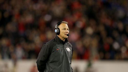 November 23, 2013 - Athens, Ga.: Georgia Bulldogs coach Mark Richt is shown on the sideline during their win over the Kentucky Wildcats at Sanford Stadium Saturday night in Athens, Ga., November 23, 2013. JASON GETZ / JGETZ@AJC.COM Mark Richt needs to at least suspend his four arrested players.