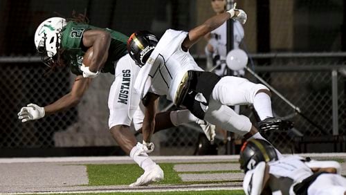 Sprayberry corner back Caleb Moss (7) is unable to stop Kennesaw Mountain running back Jah Welch (21) from scoring a touchdown in the second half of play at Kennesaw Mountain High School Friday, Sept. 10, 2021. (Daniel Varnado/For the AJC)