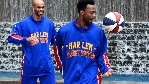 The Globetrotters' Deandre "Dragon" Taylor, right, and Jonathan "Hawk" Thomas show off some skills before an Atlanta appearance last spring.