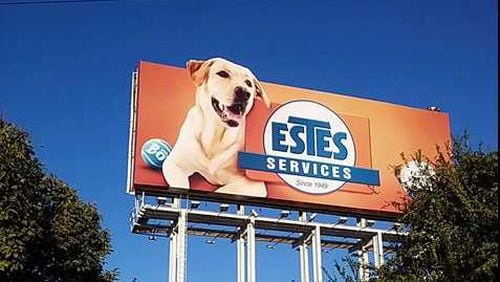 Bo, a yellow lab featured on an Estes Services billboard alongside I-85 in Buckhead, has become something of an icon.