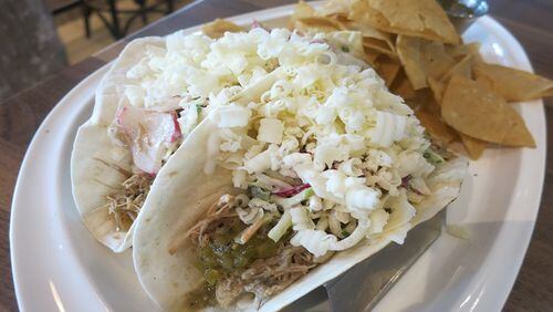 Carnitas tacos at Detroit's new Central Kitchen + Bar are filled with juicy, shredded slow-cooked pork, chayote slaw, crema, tomatillo salsa and crumbled cotija cheese on August 19, 2015. (Sylvia Rector/Detroit Free Press/TNS)