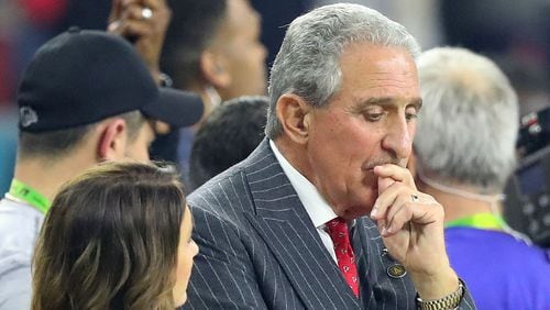 Falcons owner Arthur Blank takes a moment on the sidelines during Atlanta's Super Bowl loss to the Patriots Feb. 5, 2017, in Houston.