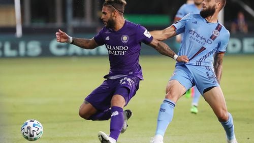 Dom Dwyer (left), who previously played for Orlando, Sporting KC and Toronto, likely will sign soon with Atlanta United. (Stephen M. Dowell/Orlando Sentinel/TNS)