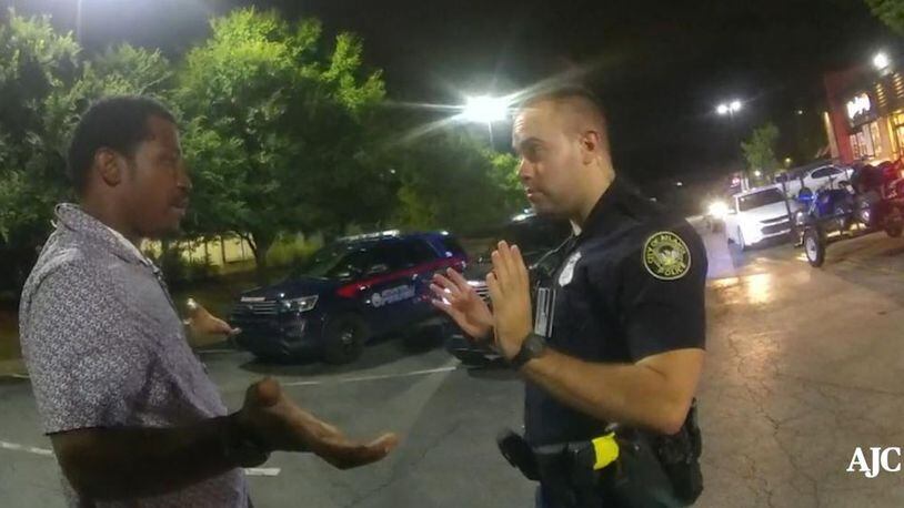 Rayshard Brooks talks with Atlanta Police Officer Garrett Rolfe in Wendy’s parking lot before Rolfe shoots him in the back, killing him. (Contributed)