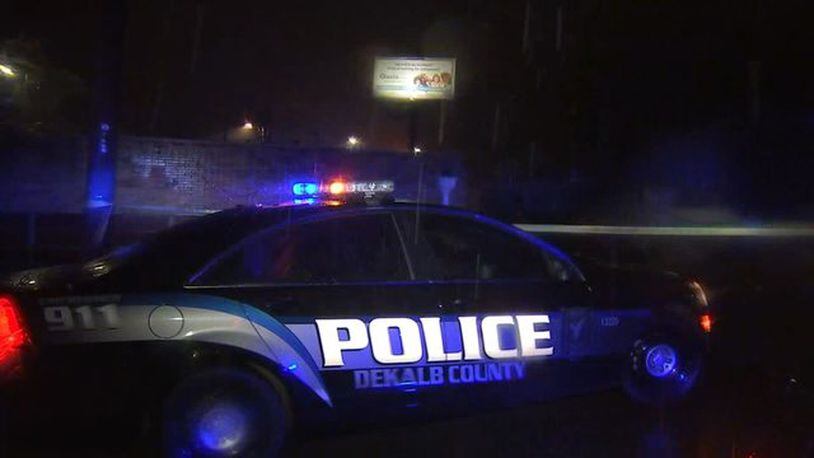 An off-duty officer found a man shot to death in his car outside a popular DeKalb County nightclub, police said.