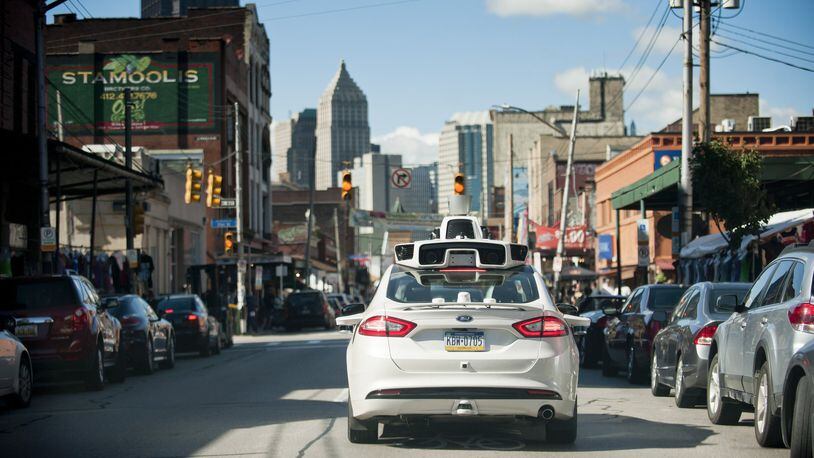 An Uber car drives through Pittsburgh in 2016 to map out the roads and topography before the planned introduction of the company’s driverless vehicles there. Uber’s experiment with autonomous vehicles is proceeding with the blessing of city officials there. The Atlanta Regional Commission visited Pittsburgh this year on its annual LINK trip. (Jeff Swensen/The New York Times)
