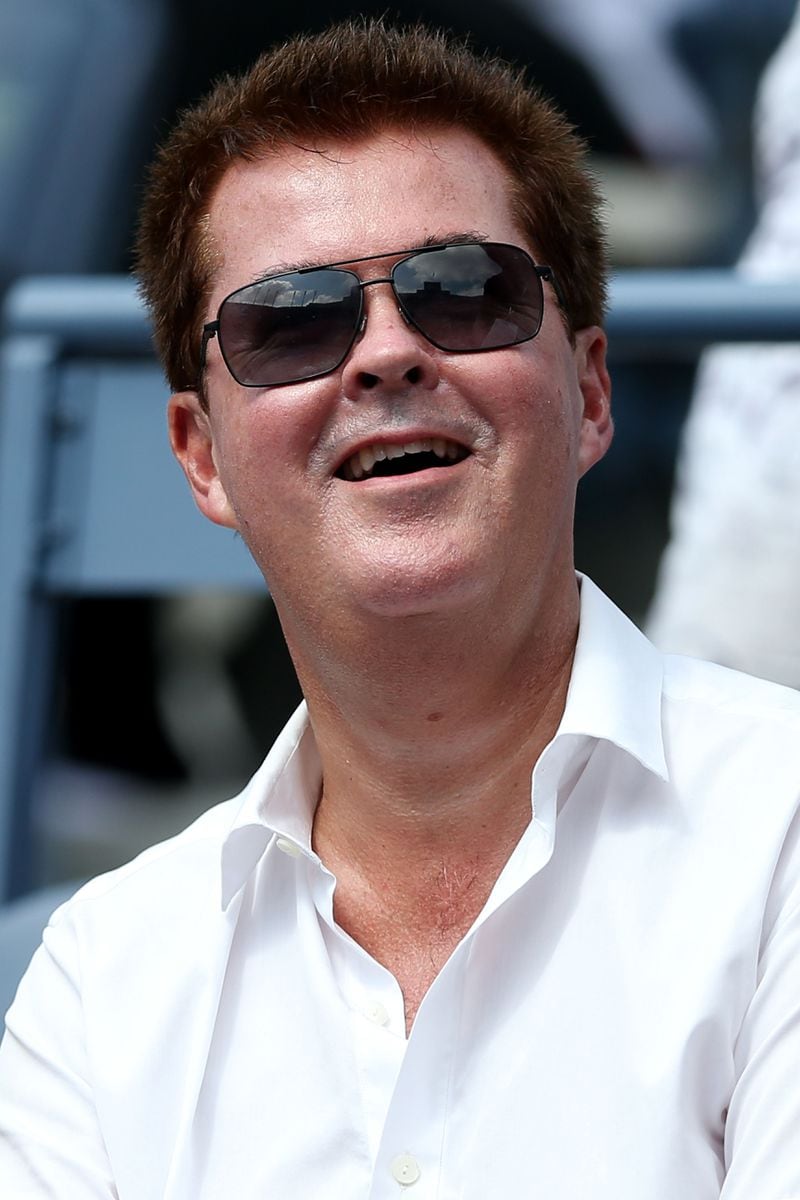 NEW YORK, NY - SEPTEMBER 08: Simon Fuller, manager of Andy Murray of Great Britain watches his men's singles semifinal match against Tomas Berdych of Czech Republic on Day Thirteen of the 2012 US Open at USTA Billie Jean King National Tennis Center on September 8, 2012 in the Flushing neighborhood of the Queens borough of New York City. (Photo by Clive Brunskill/Getty Images)