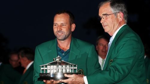 AUGUSTA, GA - APRIL 09:  Chairman of Augusta National Golf Club, William Porter Payne (R), hands the Masters Trophy to Sergio Garcia (L) of Spain during the Green Jacket ceremony after Garcia won in a playoff during the final round of the 2017 Masters Tournament at Augusta National Golf Club on April 9, 2017 in Augusta, Georgia.  (Photo by Rob Carr/Getty Images)