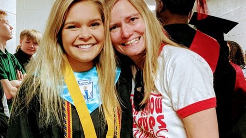 Scarlett Woodward graduated in May from Winder-Barrow High School. Although she was in the state’s dual enrollment program, none of her college credits will transfer to Columbia University in New York City. She’s seen here with her teacher Ann Locke Ridgway. CONTRIBUTED