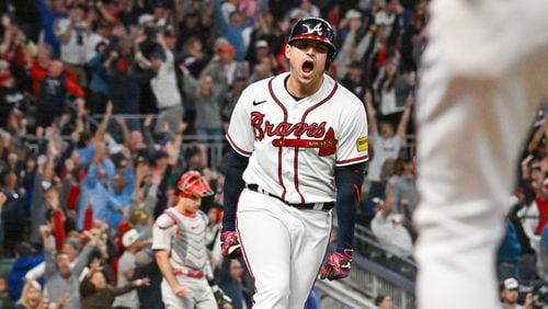 Atlanta Braves’ Austin Riley (27) celebrates a two-run home run against the Philadelphia Phillies during the eighth inning of NLDS Game 2 in Atlanta on Monday, Oct. 9, 2023.   (Hyosub Shin / Hyosub.Shin@ajc.com)