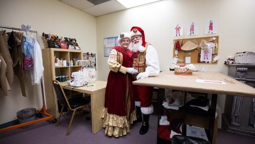 Loretta and Lou Knezevich, dressed as Santa and Mrs. Claus, pose at J&R Santaprises in Marietta. CONTRIBUTED BY BRANDEN CAMP