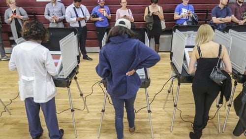 Voters waited over an hour to vote at Henry W. Grady High School in Atlanta on Tuesday, Nov. 6, 2018. JOHN SPINK / JSPINK@AJC.COM