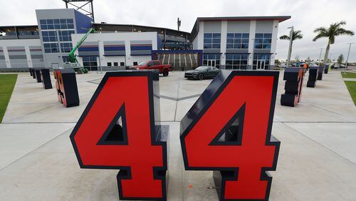 Braves retired numbers, including Hank Aaron's 44, are placed in the plaza in front of the ticket windows and merchandise store seen during a tour of CoolToday Park on Wednesday, March 20, 2019, in Venice, Florida. (Curtis Compton/ccompton@ajc.com)