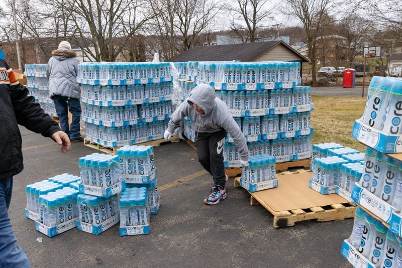 Volunteers with The Way Station hand out packages of water in East Palestine, Ohio on Friday, February 17, 2023.  (Arvin Temkar / arvin.temkar@ajc.com)