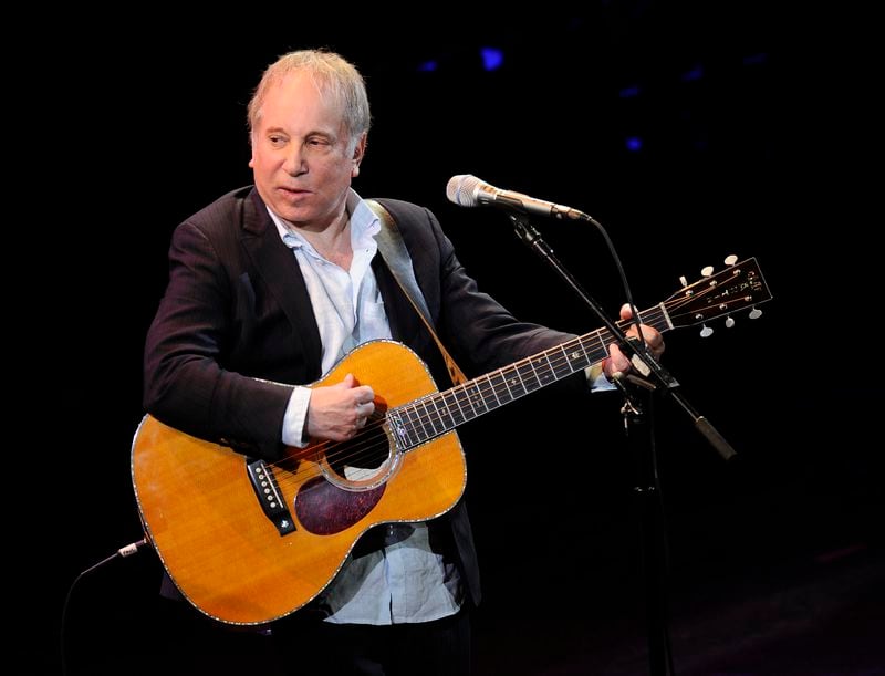 FILE - This April 2, 2012 file photo shows singer Paul Simon performing at Avery Fisher Hall in New York, April 2, 2012. Simon will sing for guests at Wednesday's White House state dinner for Japan. The White House says he's one of first lady Jill Biden's favorite musicians. (AP Photo/Evan Agostini, File)