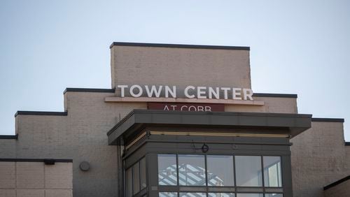 Town Center in Kennesaw was the scene of a robbery and shooting that injured both a suspect and a jewelry store employee and resulted in the theft of about $350,000 worth of custom Rolex watches.
