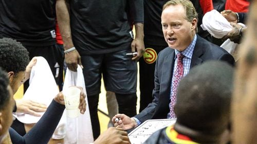 Atlanta Hawks head coach Mike Budenholzer speaks during a timeout in the first half of an NBA preseason basketball game against the New Orleans Pelicans in Jacksonville, Fla., Friday, Oct. 9, 2015. (AP Photo/Gary McCullough)