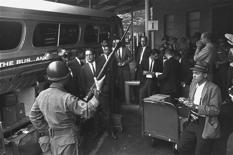 On another occasion in Montgomery, John Lewis was knocked unconscious during an attack after the Riders arrived at the bus station. This photo shows Riders getting ready to board a bus from the Montgomery station under protection of the National Guard, several days after the attack. (Perry Aycock, AP file)