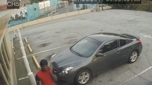 Surveillance footage shows a man Atlanta police say robbed and carjacked a woman outside a store on Moreland Avenue. (Credit: Atlanta Police Department)