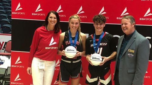 (L-R) Carly Klingler, the regional sales manager from sponsor BSN, with coed 3-point winners Bella Brick and Landon Mealor, and GHSA executive director Robin Hines.