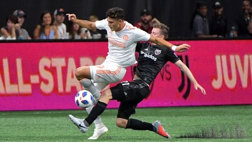 July 21, 2018  - Atlanta United forward Brandon Vazquez (left) is fouled by D.C. United midfielder Chris Durkin (21) during the second half in a MLS soccer game at Mercedes-Benz Stadium on Saturday, July 21, 2018. Three more goals from Josef Martinez set a new MLS record lifted Atlanta United to a 3-1 victory over D.C. United on Saturday at Mercedes-Benz Stadium. HYOSUB SHIN / HSHIN@AJC.COM